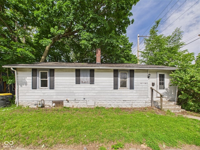 903 W 22nd St, Anderson, IN 46016 - ranch-style home featuring a chimney, a front lawn, and entry steps