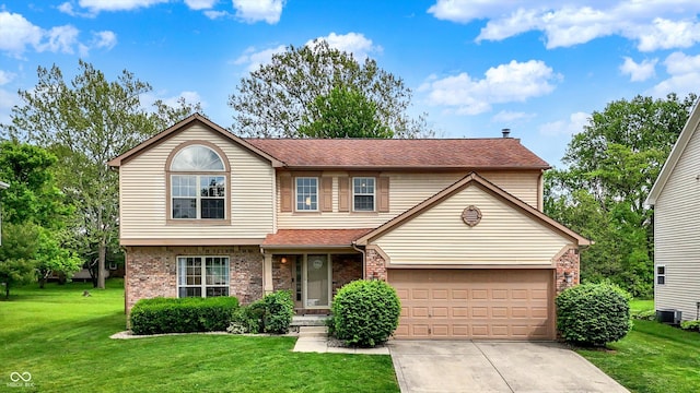 6609 Fountain Springs Blvd, Indianapolis, IN 46236 - traditional home with central AC, brick siding, driveway, and a front lawn