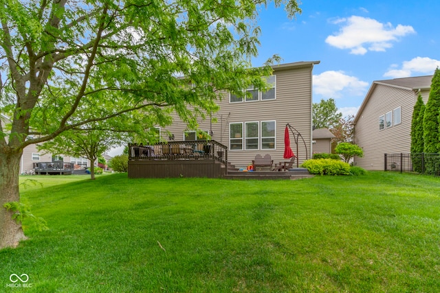back of house with a deck