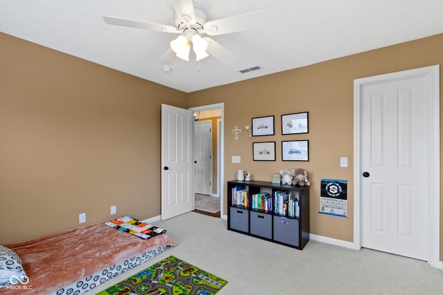playroom with carpet floors, baseboards, and ceiling fan