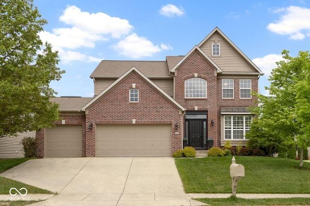 traditional home with driveway, a front yard, brick siding, and an attached garage