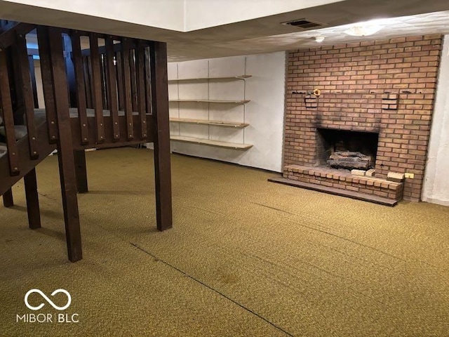 310 S Shady Ln, Muncie, IN 47304 - basement featuring carpet floors and a brick fireplace