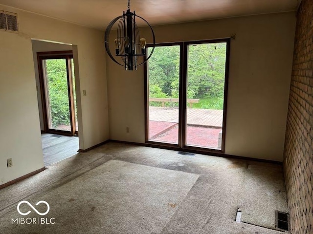 310 S Shady Ln, Muncie, IN 47304 - unfurnished dining area with carpet flooring, baseboards, and a chandelier