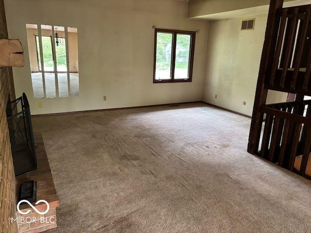 310 S Shady Ln, Muncie, IN 47304 - unfurnished living room with carpet floors and baseboards