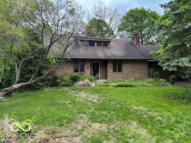 310 S Shady Ln, Muncie, IN 47304 - view of front of property with a front yard, brick siding, and a chimney