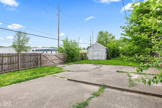 703 Kappes St, Indianapolis, IN 46221 - view of patio / terrace featuring a shed, fence, and an outdoor structure
