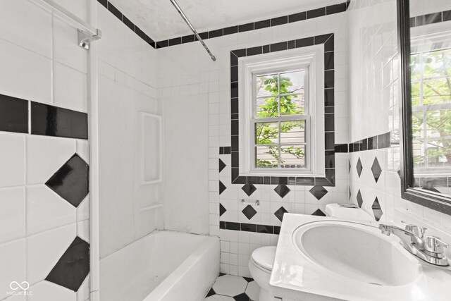 703 Kappes St, Indianapolis, IN 46221 - bathroom featuring toilet, healthy amount of natural light, tile walls,  shower combination, and vanity