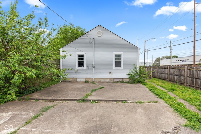703 Kappes St, Indianapolis, IN 46221 - rear view of house featuring fence and a patio area