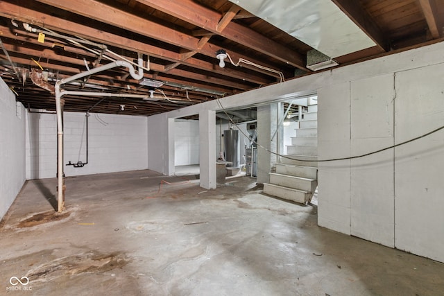 703 Kappes St, Indianapolis, IN 46221 - unfinished below grade area featuring stairway and gas water heater