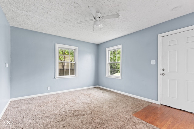 703 Kappes St, Indianapolis, IN 46221 - spare room featuring ceiling fan, a textured ceiling, baseboards, and carpet