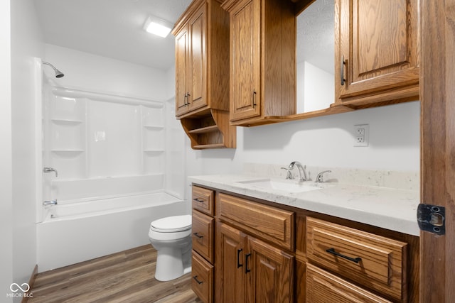 632 W Central Ave, Greensburg, IN 47240 - full bath with wood finished floors, toilet, vanity, and bathing tub / shower combination