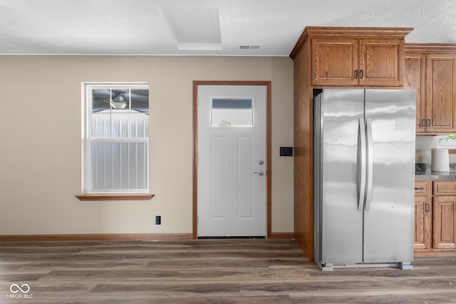 632 W Central Ave, Greensburg, IN 47240 - kitchen with freestanding refrigerator, brown cabinetry, wood finished floors, and baseboards