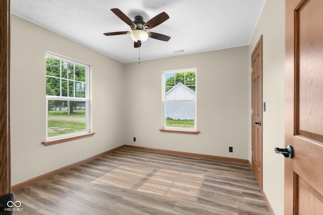 632 W Central Ave, Greensburg, IN 47240 - empty room with light wood-style floors, baseboards, and a ceiling fan