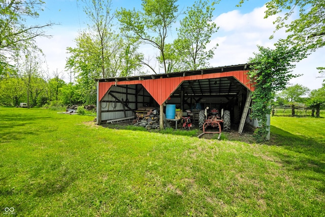 view of pole building with a lawn