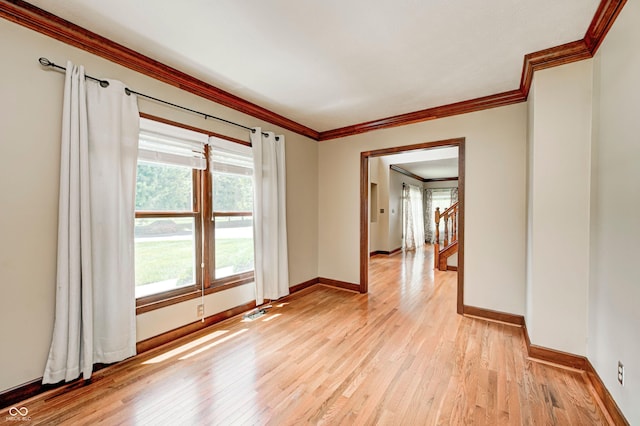 9158 Oak Knoll Ln, Fishers, IN 46037 - spare room with ornamental molding and light wood-style floors