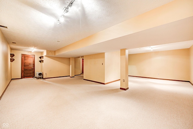 9158 Oak Knoll Ln, Fishers, IN 46037 - finished basement with light carpet and a textured ceiling