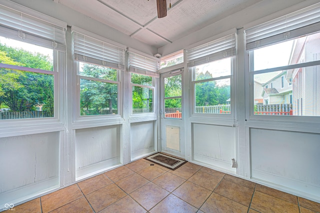 9158 Oak Knoll Ln, Fishers, IN 46037 - unfurnished sunroom featuring tile patterned flooring and ceiling fan