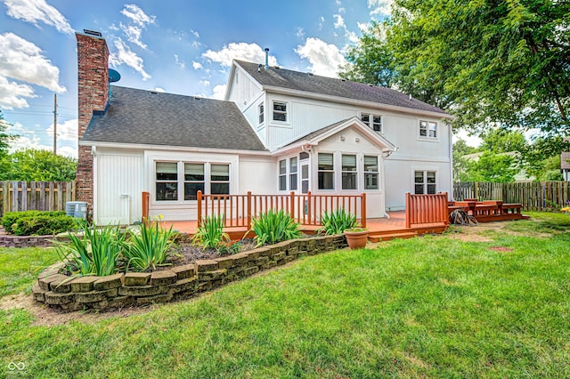 9158 Oak Knoll Ln, Fishers, IN 46037 - rear view of house with a chimney, a wooden deck, and a shingled roof