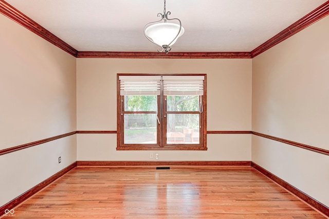 9158 Oak Knoll Ln, Fishers, IN 46037 - spare room featuring light wood-style flooring and crown molding