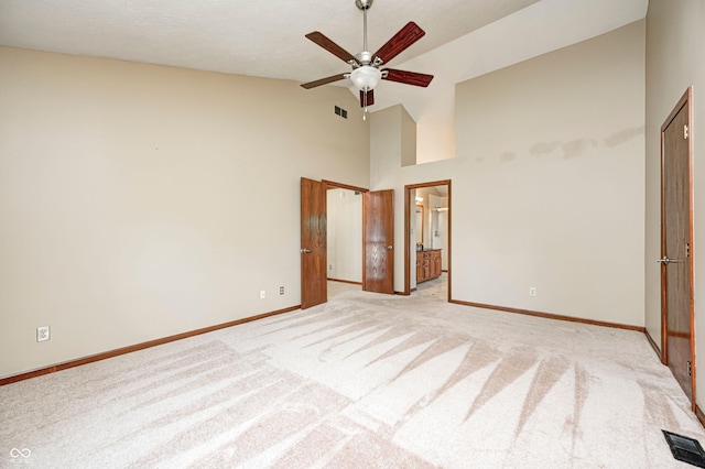 9158 Oak Knoll Ln, Fishers, IN 46037 - unfurnished bedroom with light colored carpet, high vaulted ceiling, ensuite bathroom, and ceiling fan