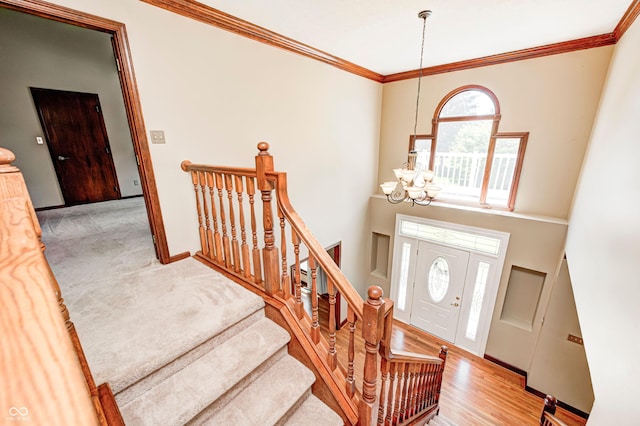 9158 Oak Knoll Ln, Fishers, IN 46037 - foyer with a chandelier and ornamental molding