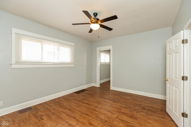 1661 S Talbott St, Indianapolis, IN 46225 - unfurnished room with ceiling fan, baseboards, and wood finished floors