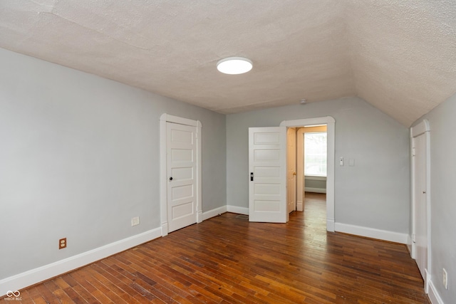 1661 S Talbott St, Indianapolis, IN 46225 - bonus room featuring a textured ceiling, wood-type flooring, baseboards, and lofted ceiling