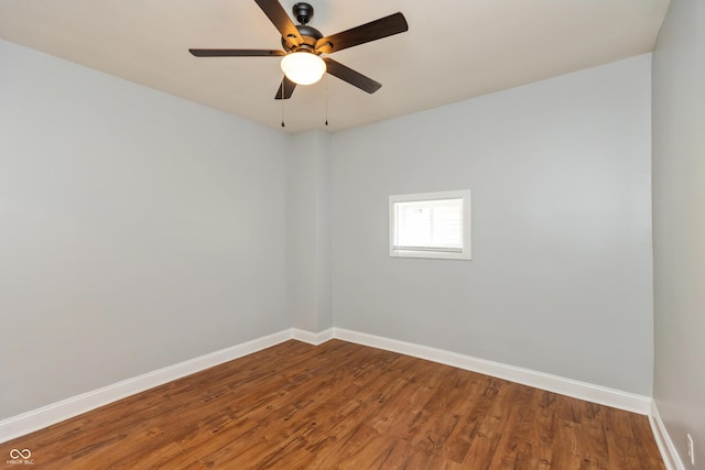 1661 S Talbott St, Indianapolis, IN 46225 - spare room featuring baseboards, wood finished floors, and ceiling fan