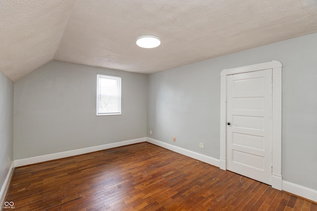 1661 S Talbott St, Indianapolis, IN 46225 - additional living space featuring a textured ceiling, hardwood / wood-style floors, baseboards, and lofted ceiling