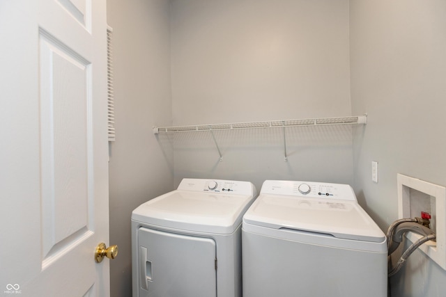 1661 S Talbott St, Indianapolis, IN 46225 - washroom with separate washer and dryer