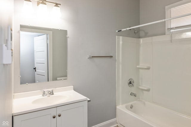 1661 S Talbott St, Indianapolis, IN 46225 - bathroom featuring vanity, shower / tub combination, and baseboards