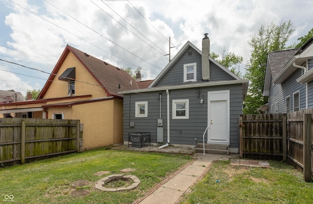 1661 S Talbott St, Indianapolis, IN 46225 - back of house featuring entry steps and a chimney