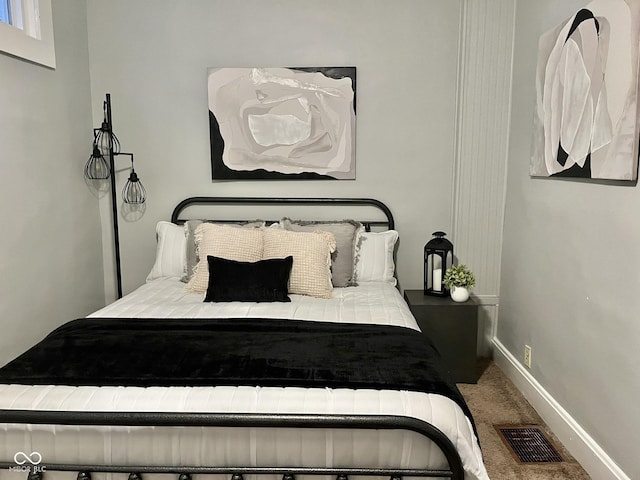 1661 S Talbott St, Indianapolis, IN 46225 - carpeted bedroom featuring baseboards