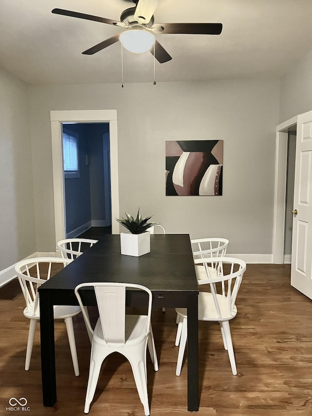 1661 S Talbott St, Indianapolis, IN 46225 - dining space with wood finished floors and a ceiling fan