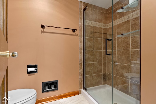 full bath with a stall shower and toilet