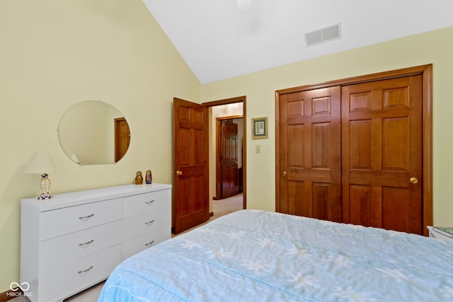 bedroom featuring vaulted ceiling, a closet, and a ceiling fan