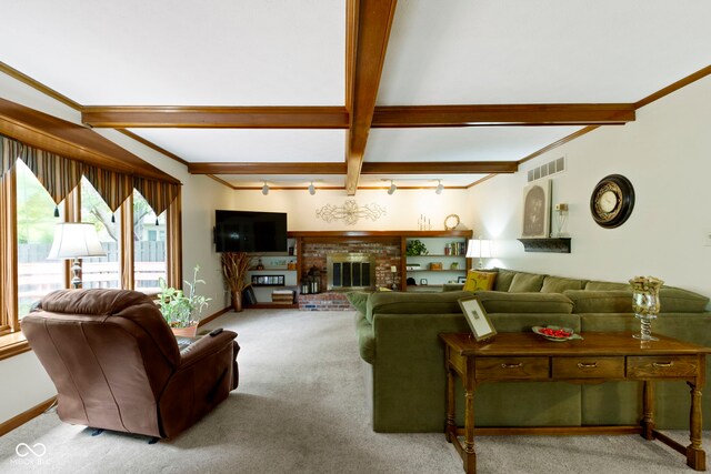 carpeted living area with beam ceiling, crown molding, baseboards, and a fireplace