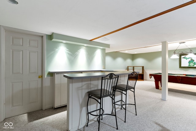 kitchen featuring billiards table, a breakfast bar area, a kitchen island, light colored carpet, and white cabinets