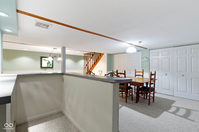 kitchen featuring carpet, pendant lighting, and recessed lighting