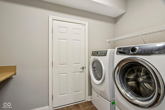 3744 Abney Point Dr, Carmel, IN 46077 - washroom featuring separate washer and dryer and dark tile patterned flooring