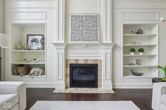 3744 Abney Point Dr, Carmel, IN 46077 - living area featuring wood finished floors, a fireplace, and built in features