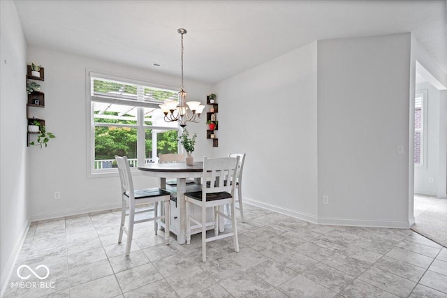 16573 Cava Dr, Fishers, IN 46037 - dining area with a chandelier and baseboards