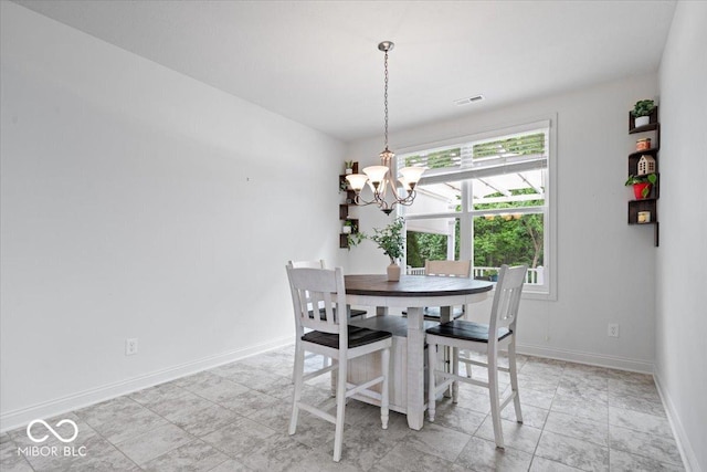 16573 Cava Dr, Fishers, IN 46037 - dining area featuring a chandelier and baseboards