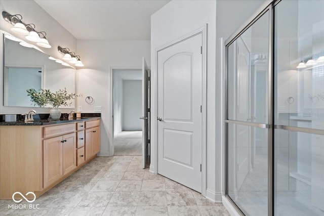 16573 Cava Dr, Fishers, IN 46037 - bathroom with a stall shower, double vanity, and baseboards