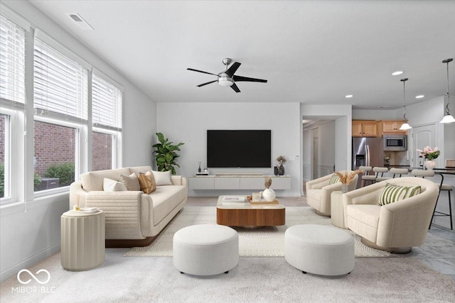 16573 Cava Dr, Fishers, IN 46037 - living area with a ceiling fan, recessed lighting, and light carpet