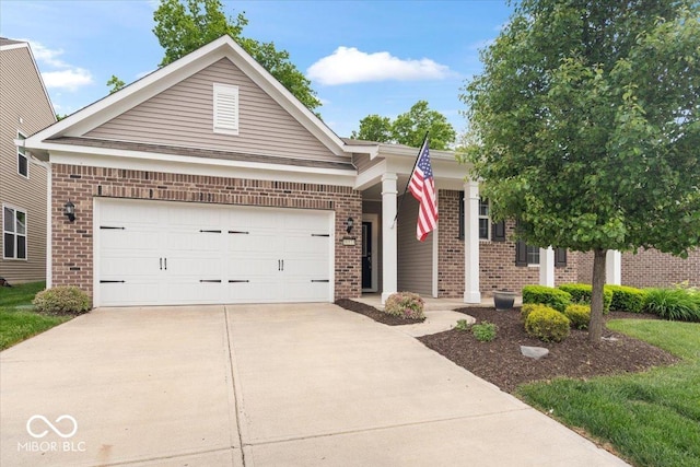 16573 Cava Dr, Fishers, IN 46037 - view of front facade with brick siding, driveway, and a garage