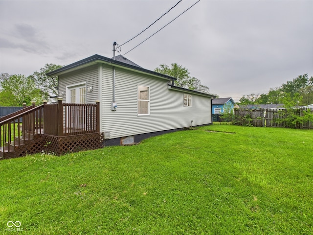 rear view of property featuring a deck