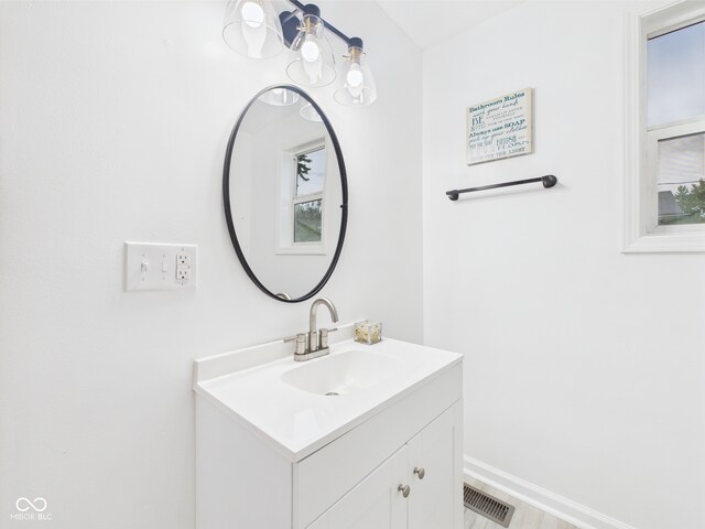 bathroom with vanity and baseboards