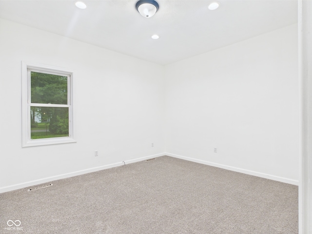 unfurnished room with carpet, recessed lighting, and baseboards