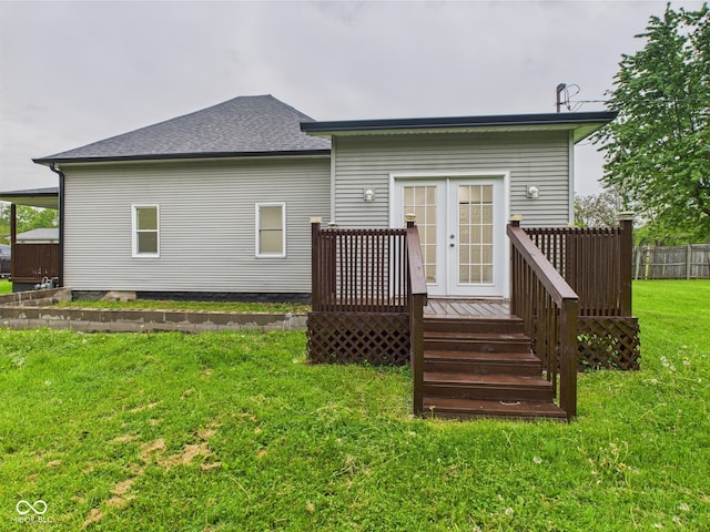rear view of house with french doors, a wooden deck, and a shingled roof